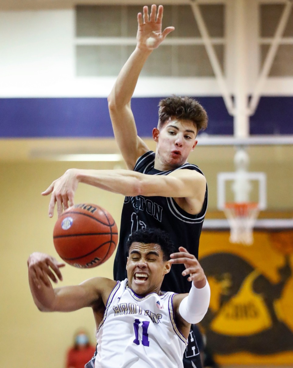 <strong>Houston forward Mason Miller (top) battles CBHS&rsquo; Reese McMullen for a rebound on Dec. 1, 2020.</strong> (Mark Weber/The Daily Memphian)