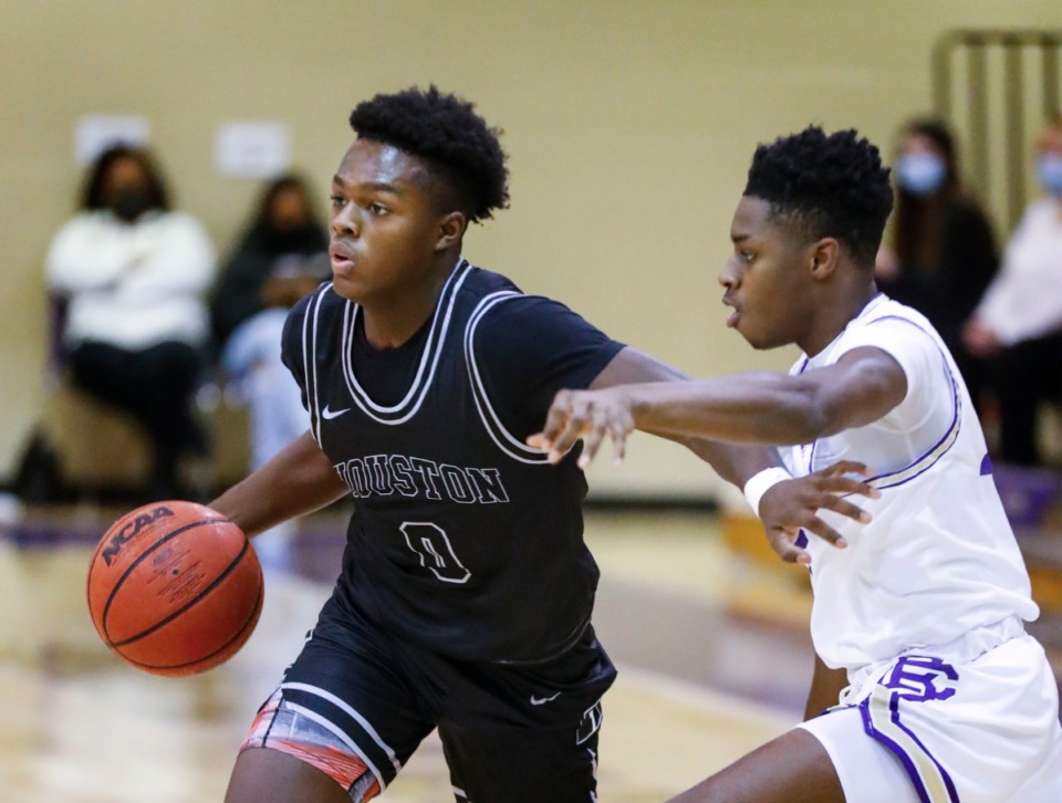 <strong>Houston guard Ahmad Nowell (left) drives by CBHS&rsquo; Zion Owens (right) on Dec. 1, 2020.</strong> (Mark Weber/The Daily Memphian)