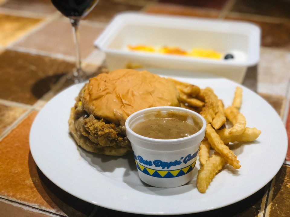 <strong>Jack Pirtle&rsquo;s steak sandwich with extra gravy; a glass of merlot and a takeout cr&ecirc;me br&ucirc;l&eacute;e from River Oaks were nice touches.</strong> (Jennifer Biggs/Daily Memphian)