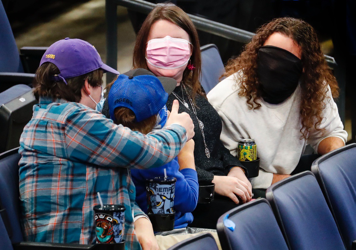 <strong>Memphis fans take a break from the game against Arkansas State to have a little fun with face masks on Dec. 2, 2020.</strong> (Mark Weber/The Daily Memphian)