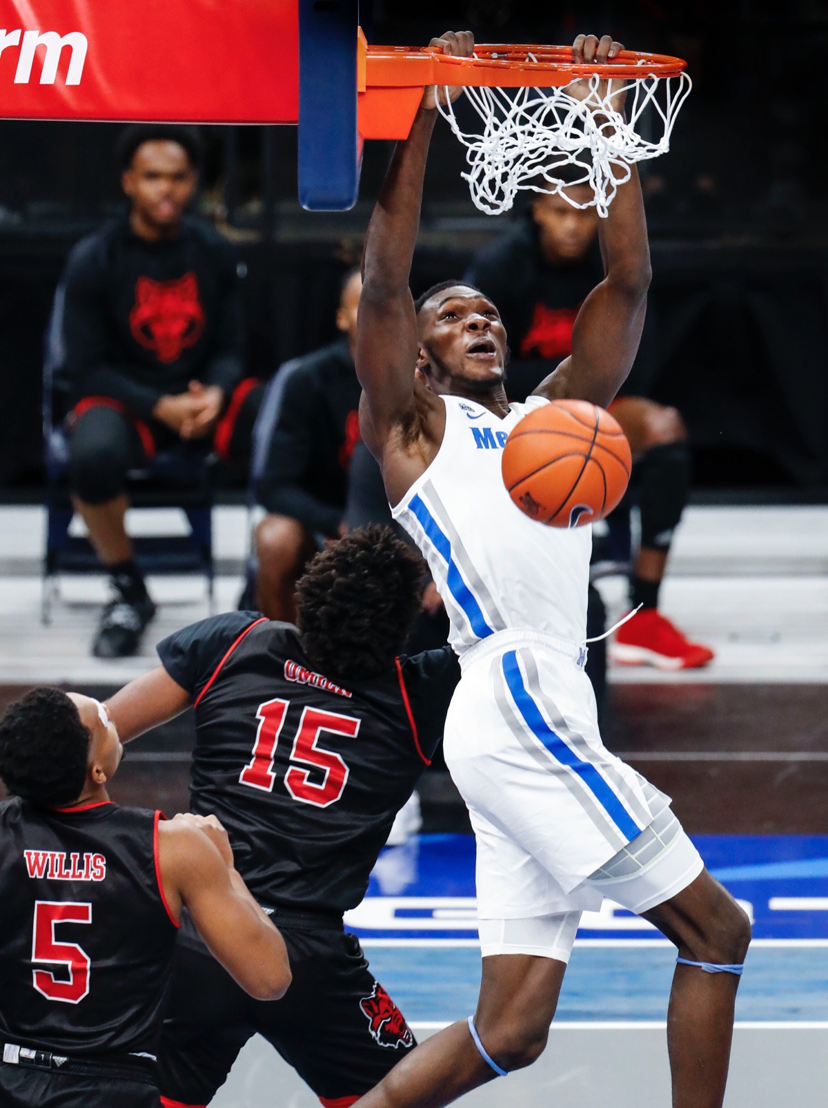 <strong>Memphis center Moussa Cisse (top) dunks over the Arkansas State defense on Wednesday, Dec. 2, 2020.</strong> (Mark Weber/The Daily Memphian)