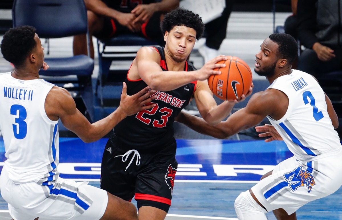 <strong>Memphis&rsquo; Landers Nolley II (left) and Alex Lomax apply pressure on Arkansas State guard Marquis Eaton (middle) on Dec. 2, 2020.</strong> (Mark Weber/The Daily Memphian)