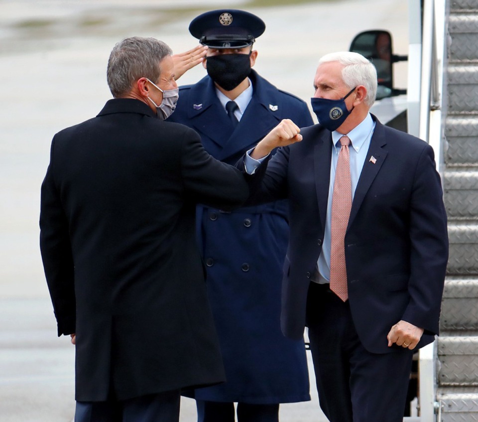 <strong>Vice President Mike Pence elbow bumps Tennessee Gov. Bill Lee as Pence arrives in Memphis on Thursday, Dec. 3, to give an update on Operation Warp Speed.</strong> (Patrick Lantrip/Daily Memphian)
