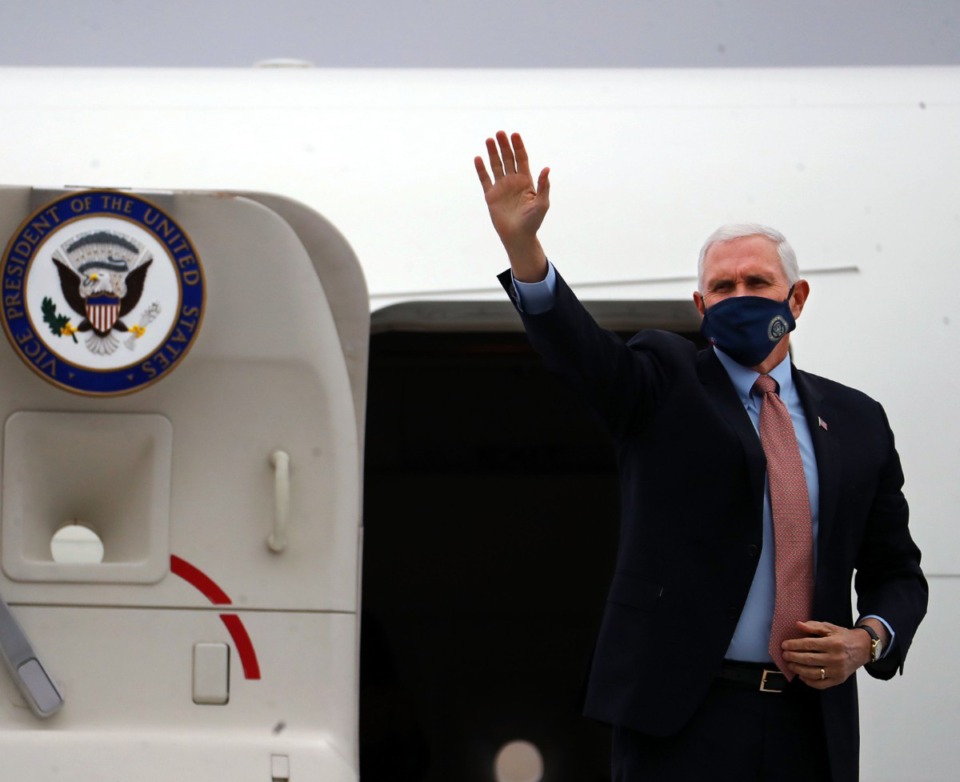 <strong>Vice President Mike Pence waves to people in attendance as he gets off Air Force 2 after landing in Memphis on Thursday, Dec. 3.</strong> (Patrick Lantrip/Daily Memphian)