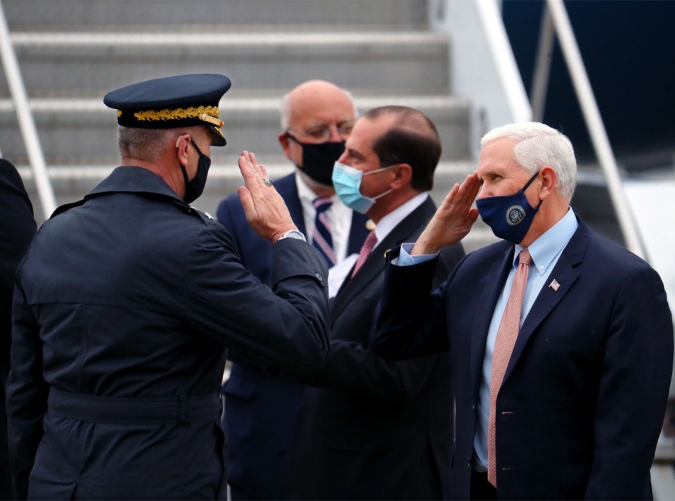 <strong>Vice President Mike Pence salutes a service member after landing in Memphis for an Operation Warp Speed roundtable on Thursday, Dec. 3.</strong> (Patrick Lantrip/Daily Memphian)