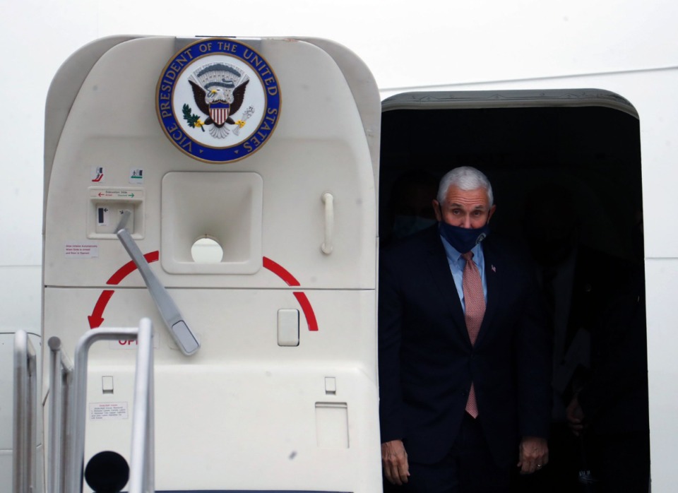 <strong>Vice President Mike Pence peeks out of Air Force 2 after landing at Memphis International Airport on Thursday, Dec. 3.</strong> (Patrick Lantrip/Daily Memphian)