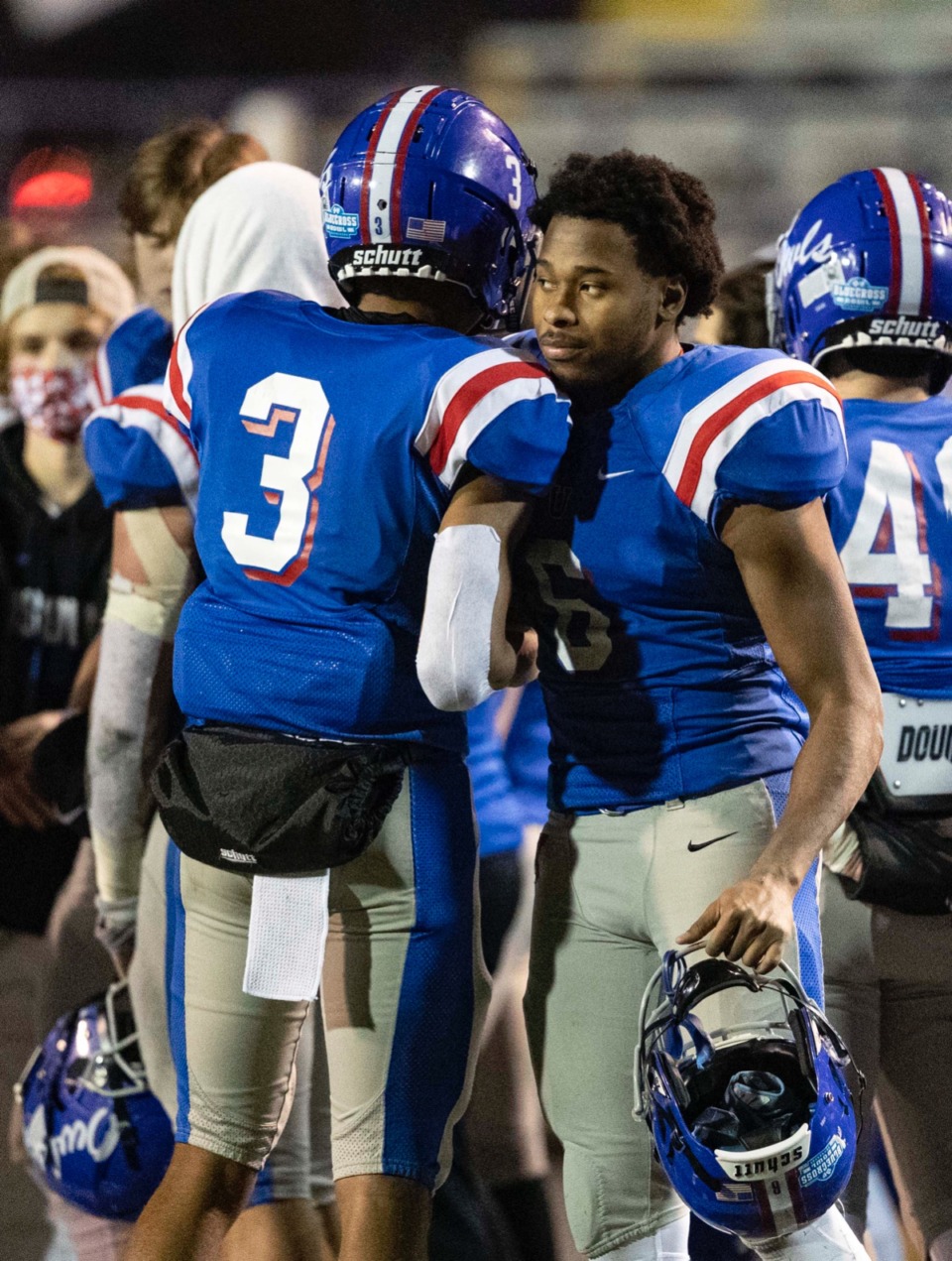 <strong>Roderic Lewis and Tylyn Young of MUS console each other after the loss to McCallie.</strong> (Wade Payne/www.wadepaynephoto.com)