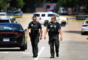 <strong>Two Memphis Police Officer survey a chaotic crime scene in Downtown Memphis on August 5.</strong> (Patrick Lantrip/Daily Memphian file)