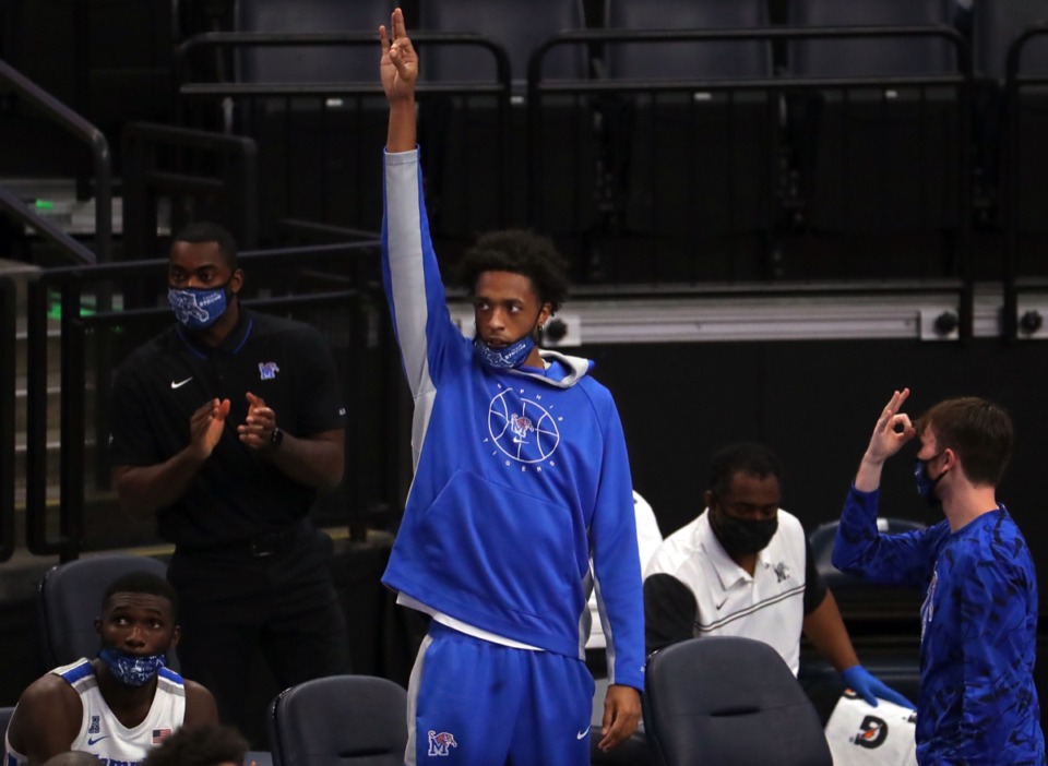 <strong>University of Memphis forward Deandre Williams holds up three fingers in celebration after a teammate hits an open three against Central Arkansas on Dec. 4, 2020.</strong> (Patrick Lantrip/Daily Memphian)