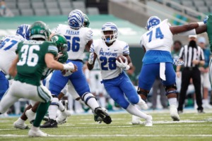 <strong>Asa Martin (28) looks for an opening in Saturday&rsquo;s 35-21 loss to Tulane in New Orleans. Martin and the other Tiger running backs only managed 45 yards on 28 attempts.&nbsp;</strong>(Tyler Kaufman/Memphis Athletics)