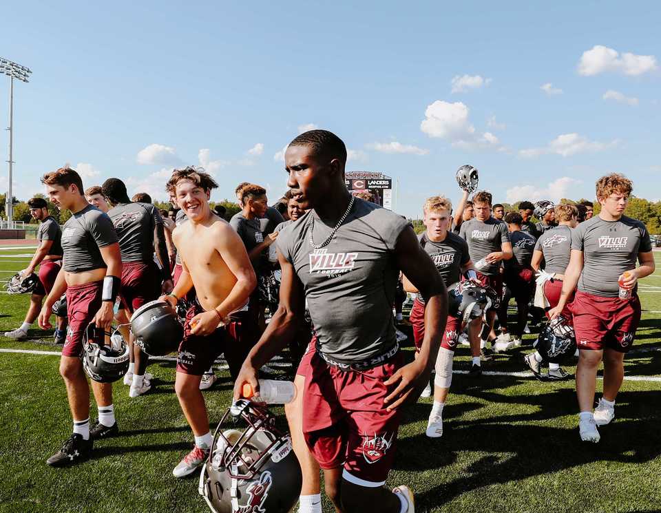 <strong>The Collierville High School football team jogs to the locker room after practice Thursday, Sept. 20. The high school's new football stadium is one of the new amenities the public school has to offer.</strong> (Houston Cofield/Daily Memphian)