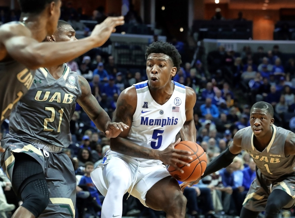 <strong>Memphis&rsquo; Kareem Brewton Jr.,&nbsp; going around UAB defenders in the Tigers&rsquo; game at FedExForum on Dec. 9, is the team&rsquo;s fourth-leading scorer with 7.8 points per game.</strong> (Karen Pulfer Focht/Special to The Daily Memphian)&nbsp;