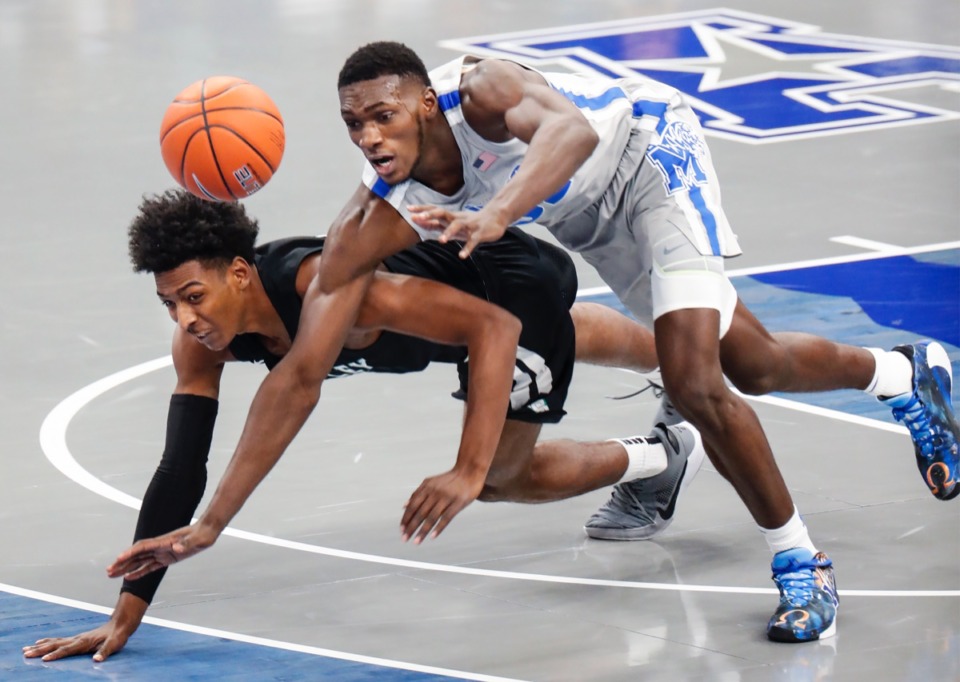 <strong>Memphis defender Moussa Cisse (right) battles Mississippi Valley State guard Jordan Johnson (left) for a loose ball on Tuesday, Dec. 8, 2020.</strong> (Mark Weber/The Daily Memphian)