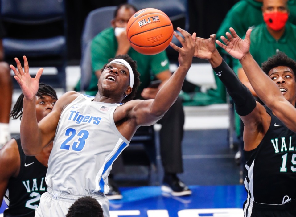 <strong>Memphis forward Malcolm Dandridge (left) looks to grab a rebound against Mississippi Valley State Tuesday.</strong> (Mark Weber/The Daily Memphian)