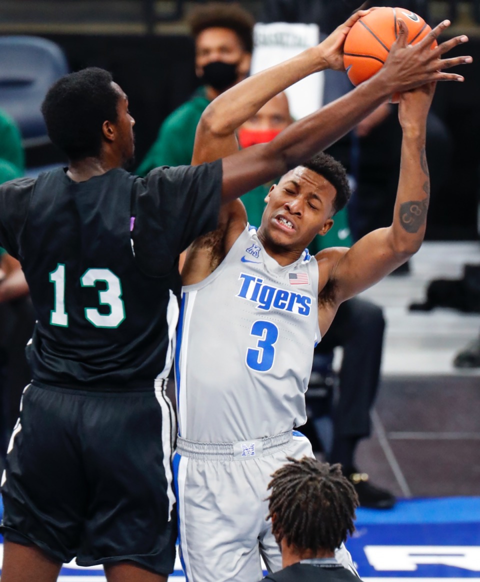 <strong>Memphis guard Landers Nolley II (right) is fouled by Mississippi Valley State defender Ronald Williams (left) on Dec. 8, 2020.</strong> (Mark Weber/The Daily Memphian)