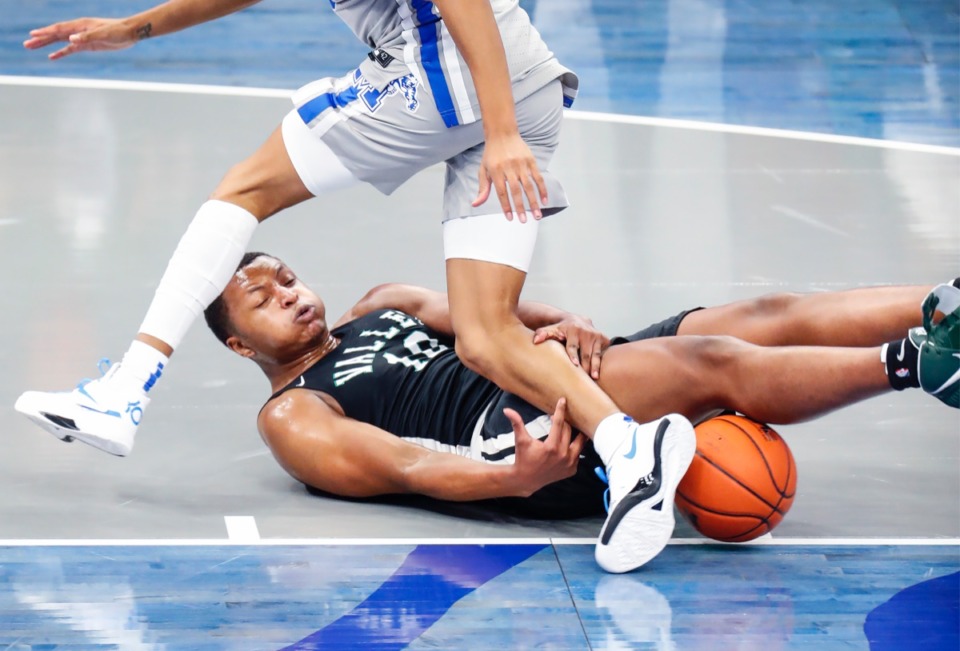 <strong>Mississippi Valley State guard Devin Gordon (bottom) loses the ball in the game against Memphis on Tuesday, Dec. 8, 2020.</strong> (Mark Weber/The Daily Memphian)