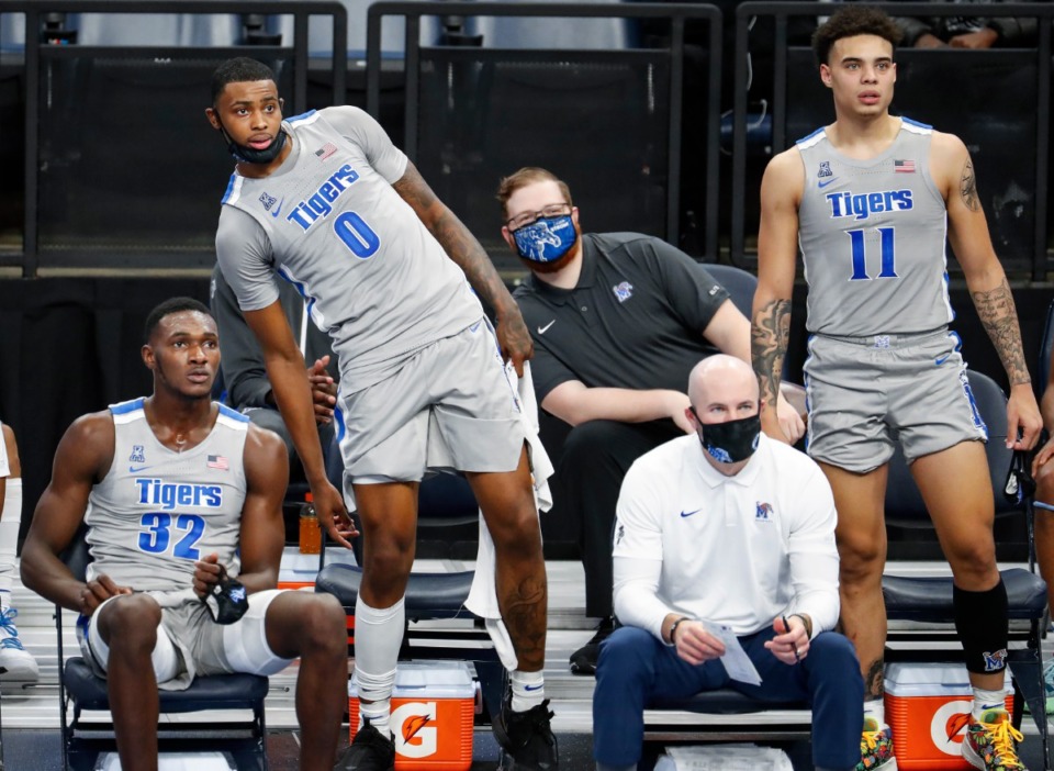 <strong>Memphis teammates (left to right) Moussa Cisse, D.J. Jeffries and Lester Quinones watch from the bench in the game against Mississippi Valley State on Tuesday, Dec. 8, 2020.</strong> (Mark Weber/The Daily Memphian)