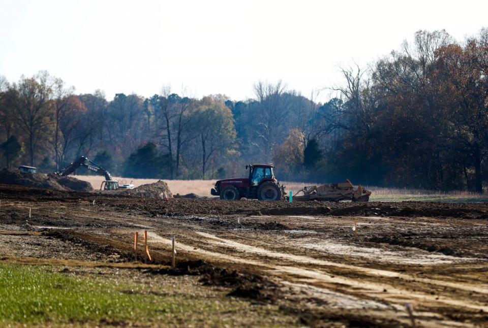 <strong>A heavy-equipment operator levels land as construction begins Tuesday, Dec. 8, on the Lakeland Meadows subdivision in Lakeland.&nbsp;The 367-home development sits on 193 acres at Seed Tick and Old Brownsville roads.</strong> (Mark Weber/Daily Memphian)