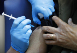 <strong>A nurse administers the Pfizer-BioNTech COVID-19 vaccine at Guy's Hospital in London on Tuesday, Dec. 8, 2020. Shelby County Health Department Director Alisa Haushalter said the goal is to vaccinate 70% or more of the Shelby County population against coronavirus in the next year</strong>. (AP Photo/Frank Augstein, Pool)