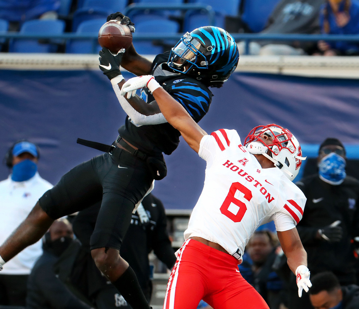 <strong>University of Memphis wide receiver Tahj Washington (18) goes up for a catch during a Dec. 12, 2020 game against the University of Houston.</strong> (Patrick Lantrip/Daily Memphian)