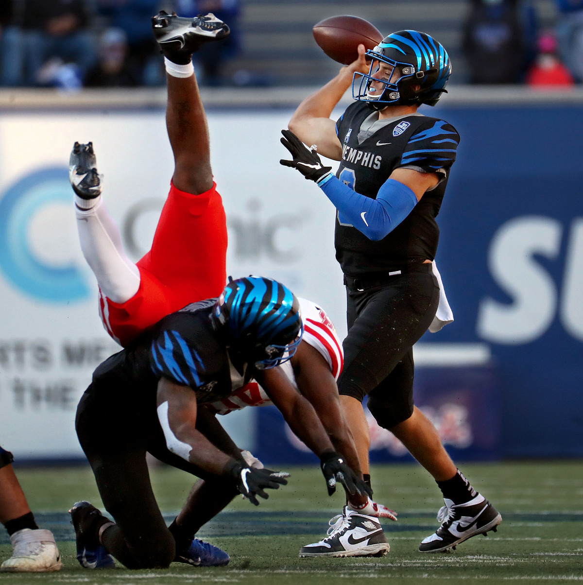 <strong>University of Memphis quarterback Brady White hangs in the pocket to complete a pass during the Tigers 30-27 win over Houston, Saturday, Dec. 12, at the Liberty Bowl. </strong>(Patrick Lantrip/Daily Memphian)