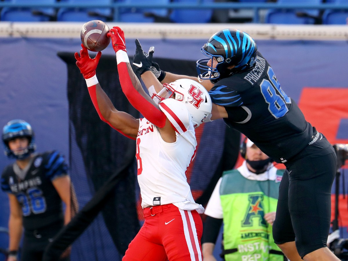 <strong>University of Houston cornerback intercepts the ball over University of Memphis tight end Caden Prieskom (86) during a Dec. 12, 2020 game against the University of Houston.</strong> (Patrick Lantrip/Daily Memphian)