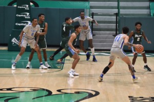 <strong>Memphis guard Lester Quinones (11) looks to pass in the Tigers&rsquo; 80-74 win over Tulane on Dec. 16, 2020.</strong> (Courtesy Tulane)