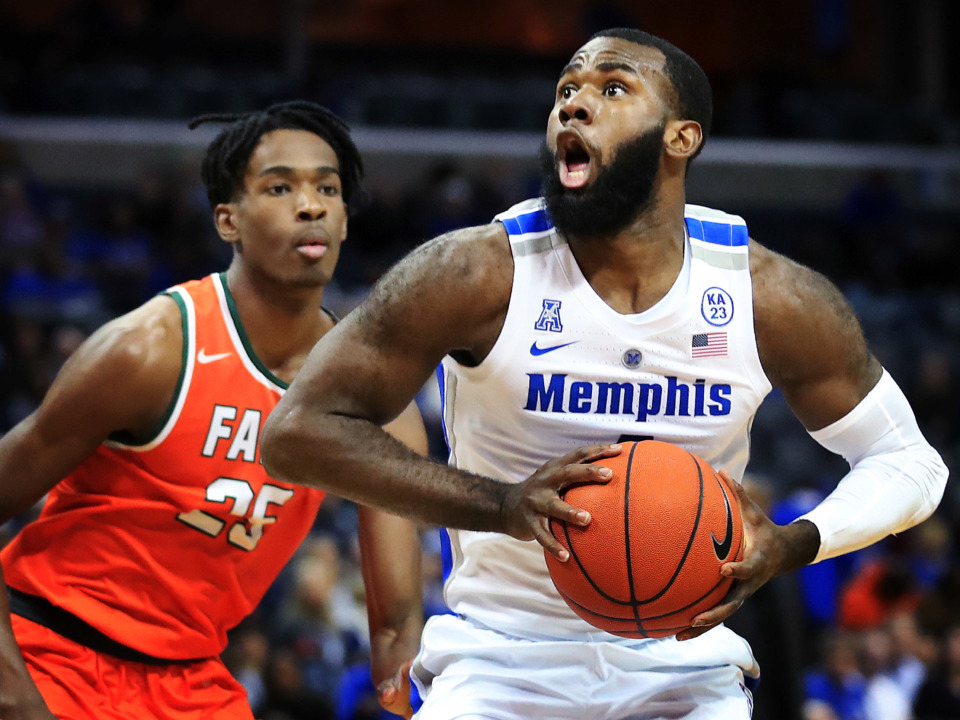 <strong>University of Memphis forward Raynere Thornton (4) shoots under pressure by Florida A&amp;M's DJ Jones during the Tigers game against the Rattlers at the FedExForum on Dec. 29, 2018.</strong> (Jim Weber/Daily Memphian)