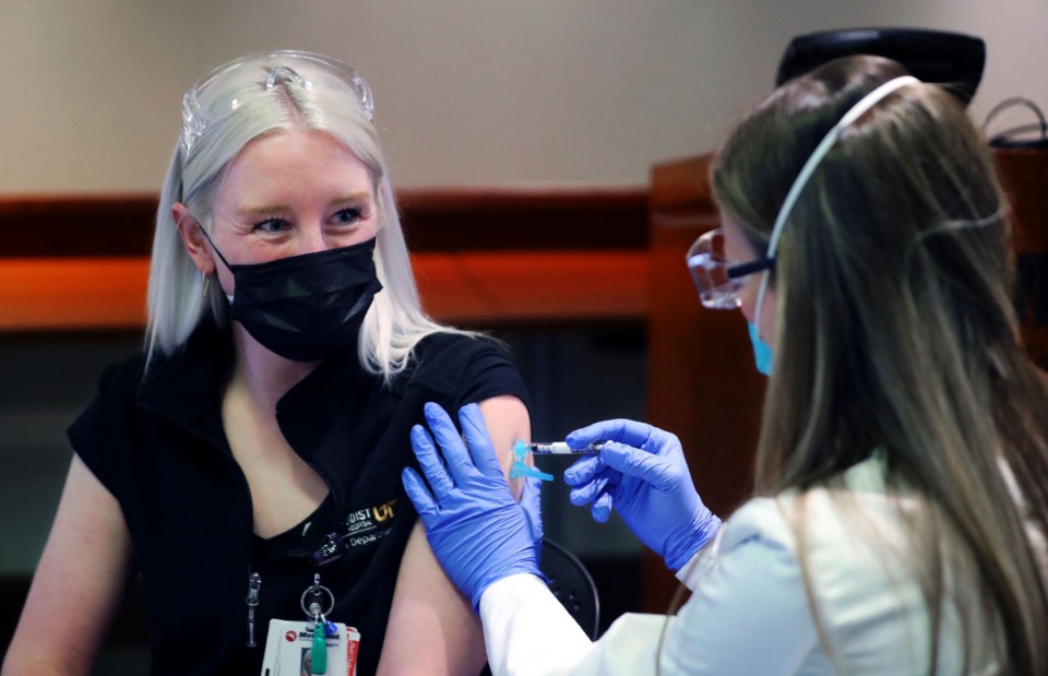 <strong>Sterling Torian vaccinates Chelsea Mitchell at Methodist University Hospital Dec. 17, 2020.</strong> (Patrick Lantrip/Daily Memphian)
