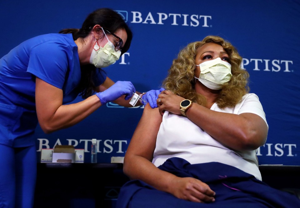 <strong>Marilyn Davis, a Baptist employee who was the first person in Shelby County to be diagnosed with COVID-19, is among the first people in Tennessee to get a vaccine at Baptist Memorial Hospital Dec. 17, 2020.</strong> (Patrick Lantrip/Daily Memphian)
