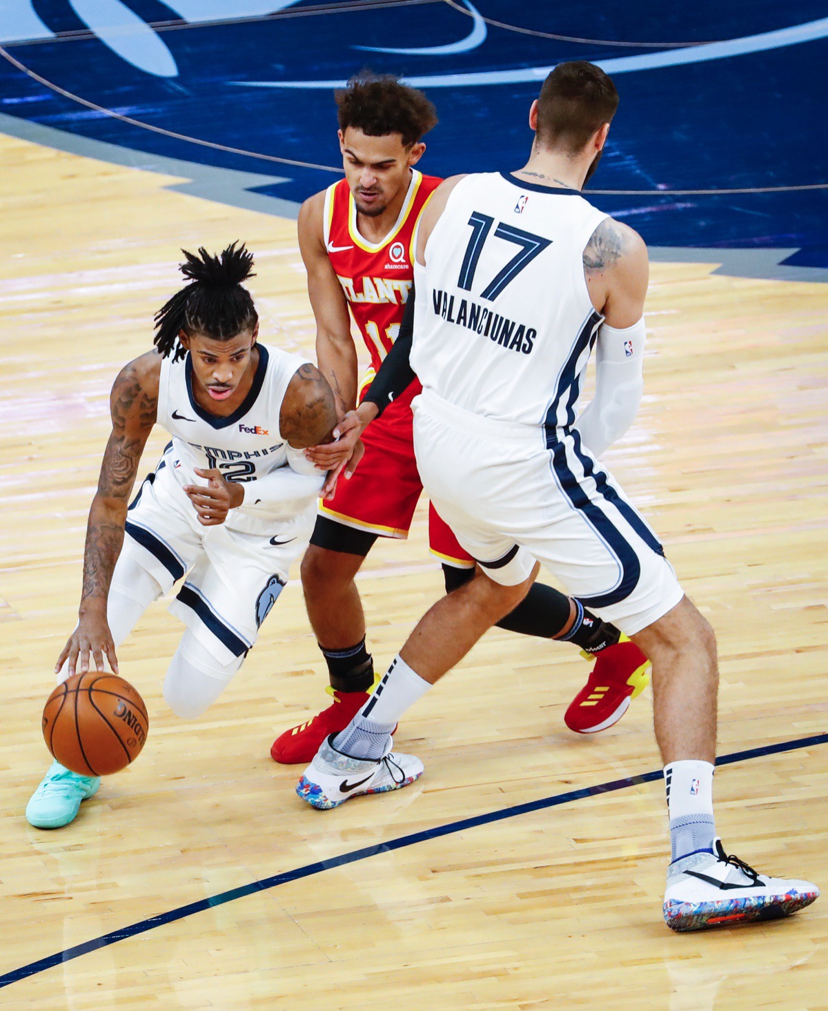 <strong>Memphis Grizzlies guard Ja Morant (left) drives around Atlanta&rsquo;s Trae Young (right) off the pick from teammate Jonas Valanciunas (right) on Thursday, Dec. 17, 2020.</strong> (Mark Weber/The Daily Memphian)