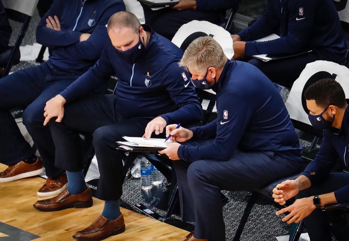 <strong>Memphis Grizzlies head coach Tyler Jenkins (left) looks over plays on the bench on Dec. 17, 2020.</strong> (Mark Weber/The Daily Memphian)