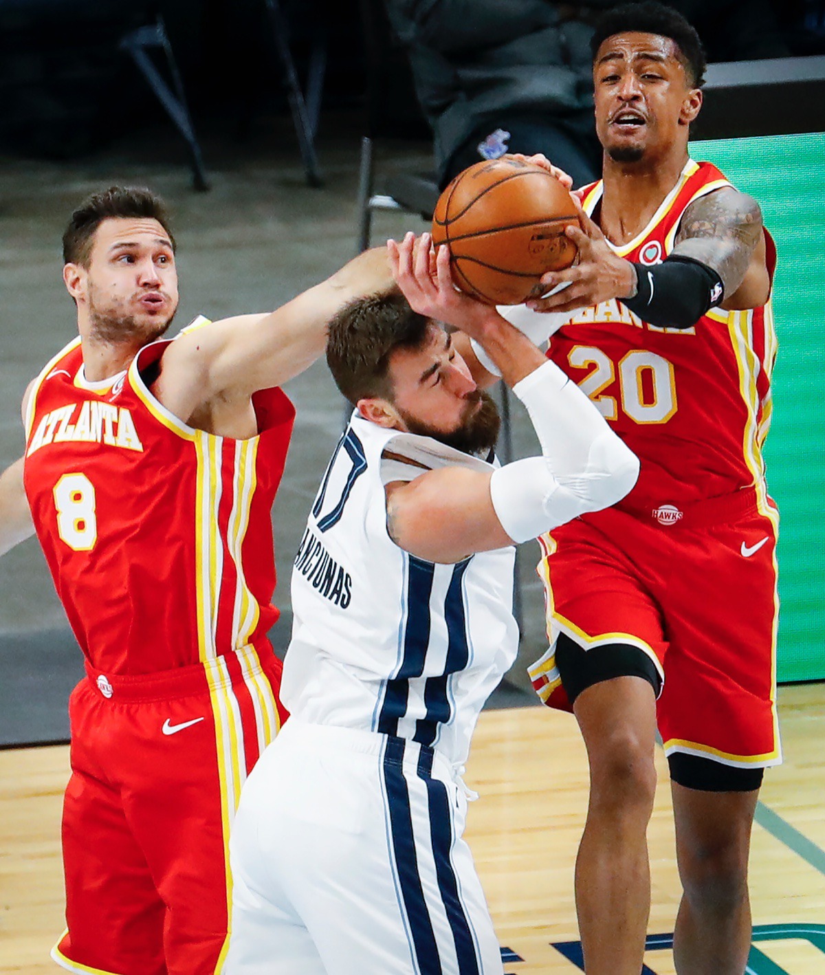 <strong>Grizzlies center Jonas Valanciunas (middle) battles Atlanta&rsquo;s Danilo Gallinari (left) and John Collins (right) for a rebound on Thursday, Dec. 17, 2020.</strong> (Mark Weber/The Daily Memphian)