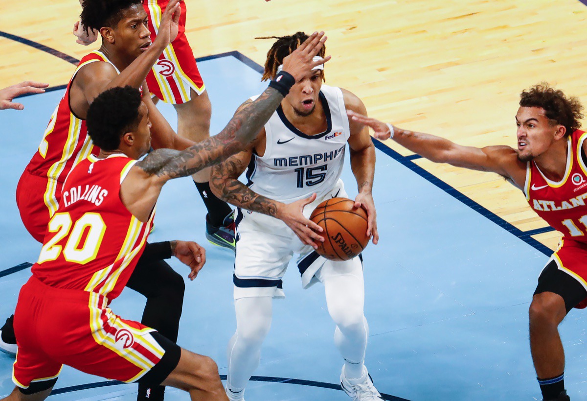 <strong>Grizzlies forward Brandon Clarke (middle) grabs a rebound against Atlanta on Thursday, Dec. 17, 2020.</strong> (Mark Weber/The Daily Memphian)