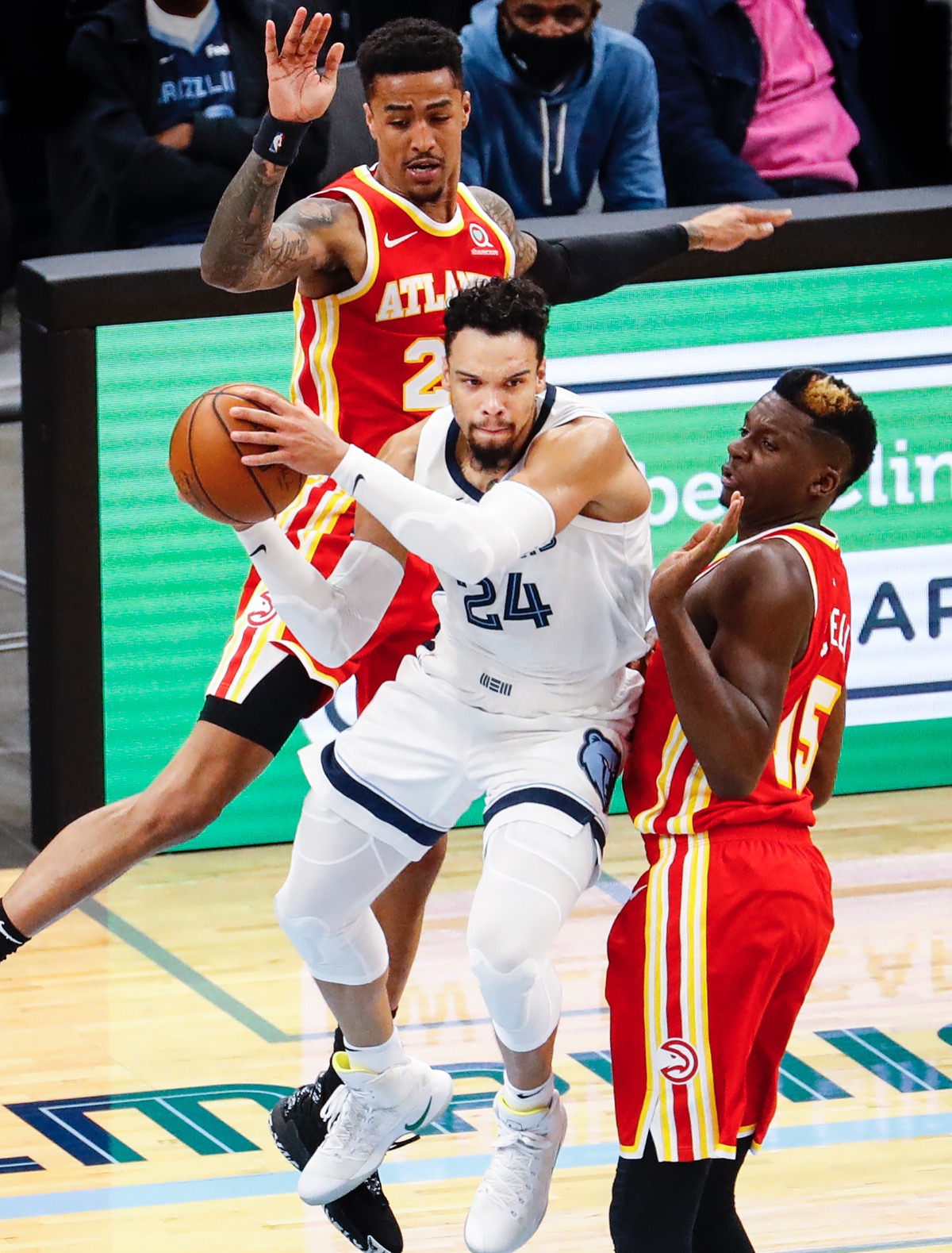 <strong>Grizzlies guard Dillon Brooks (middle) looks to make a pass after driving the lane against Atlanta&rsquo;s John Collins (top) and Clint Capela (right).</strong> (Mark Weber/The Daily Memphian)