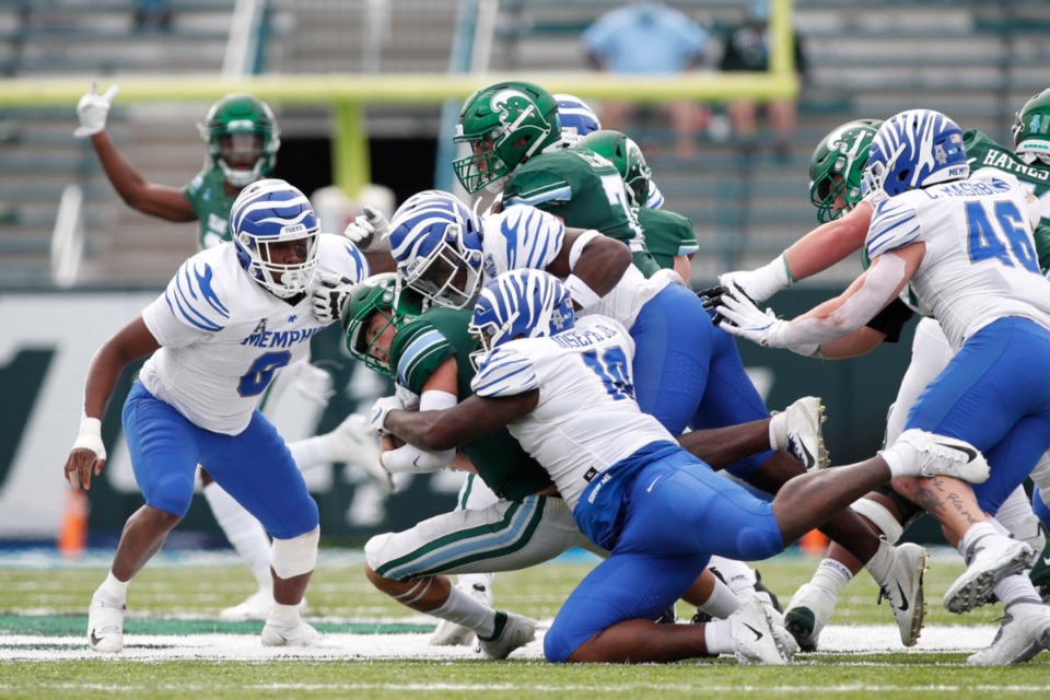 <strong>The Tigers defense brings down the Tulane runner Saturday, Dec. 5 in New Orleans.</strong> (Tyler Kaufman/Memphis Athletics)