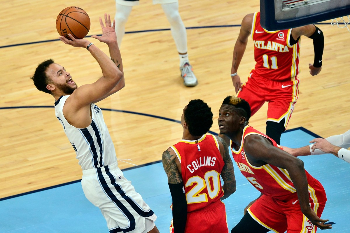 <strong>Memphis Grizzlies forward Kyle Anderson shoots against Atlanta Hawks forward John Collins (20) and center Clint Capela (15) in the first half of an NBA preseason basketball game Saturday, Dec. 19, 2020, at FedExForum.</strong> (Brandon Dill/AP)