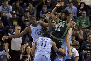 <strong>Memphis Grizzlies forward Jaren Jackson Jr. (13), Boston Celtics guard Kyrie Irving (11), and Grizzlies center Marc Gasol, right, collide as Grizzlies guard Mike Conley (11) controls the ball during the first half of an NBA&nbsp; game Saturday, Dec. 29, 2018, in Memphis.</strong> (AP Photo/Brandon Dill)