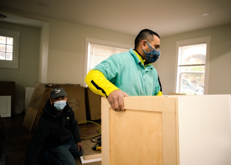 <strong>Vladimir Aguilar is installing a new kitchen in Matt Wallace of The Wallace Group at Keller Williams Realty bought to renovate and resell.</strong> (Houston Cofield/Special Daily Memphian)