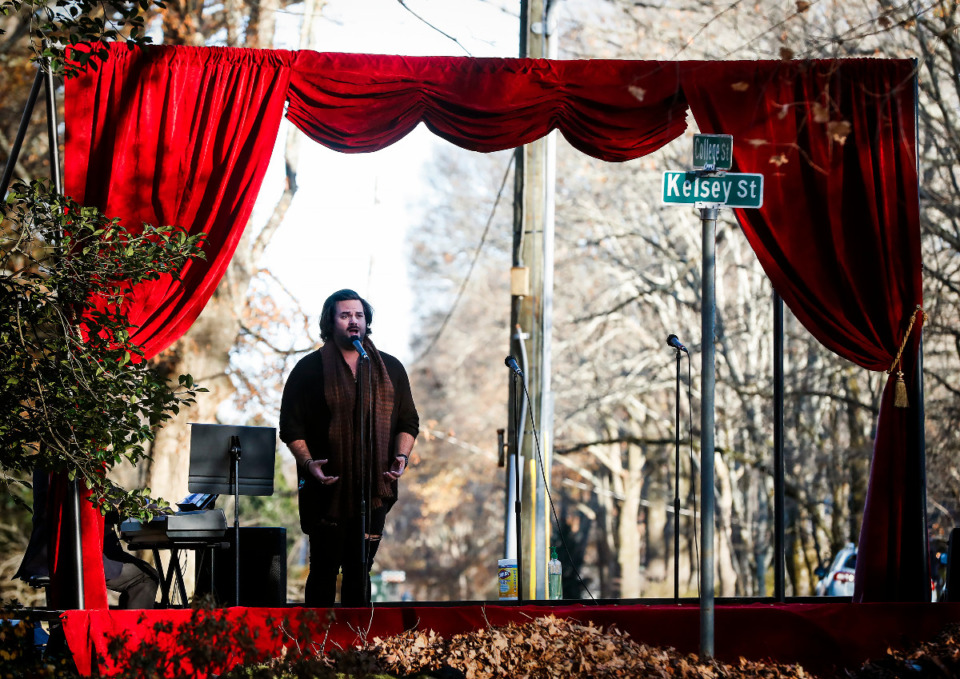 <strong>Opera Memphis singer Dane Suarez performs to a small crowd from the flatbed truck during an outdoor Collierville neighborhood performance on Monday, Dec. 21, 2020.</strong> (Mark Weber/The Daily Memphian)