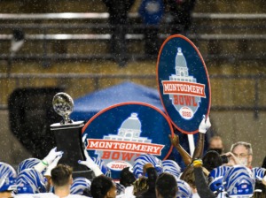 <strong>The Memphis Tigers hoist their trophy after ending the program&rsquo;s five-game bowl losing streak Wednesday, Dec. 23, with a 25-10 win over Florida Atlantic in the Montgomery Bowl in Montgomery, Alabama.</strong> (Julie Bennett/Memphis Athletics)