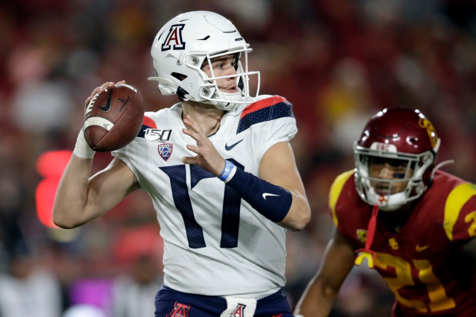 <strong>Arizona quarterback Grant Gunnell (17) looks for a receiver during the second half of the team's NCAA college football game against Southern California on Saturday, Oct. 19, 2019, in Los Angeles.</strong> (Marcio Jose Sanchez/AP)