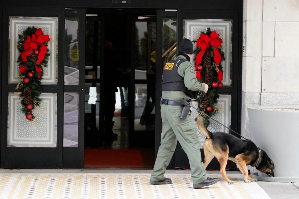 <strong>A K-9 team works in the area of an explosion in downtown Nashville, Friday, Dec. 25, 2020. Buildings shook in the immediate area and beyond after a loud boom was heard early Christmas morning.</strong> (Mark Humphrey/AP)