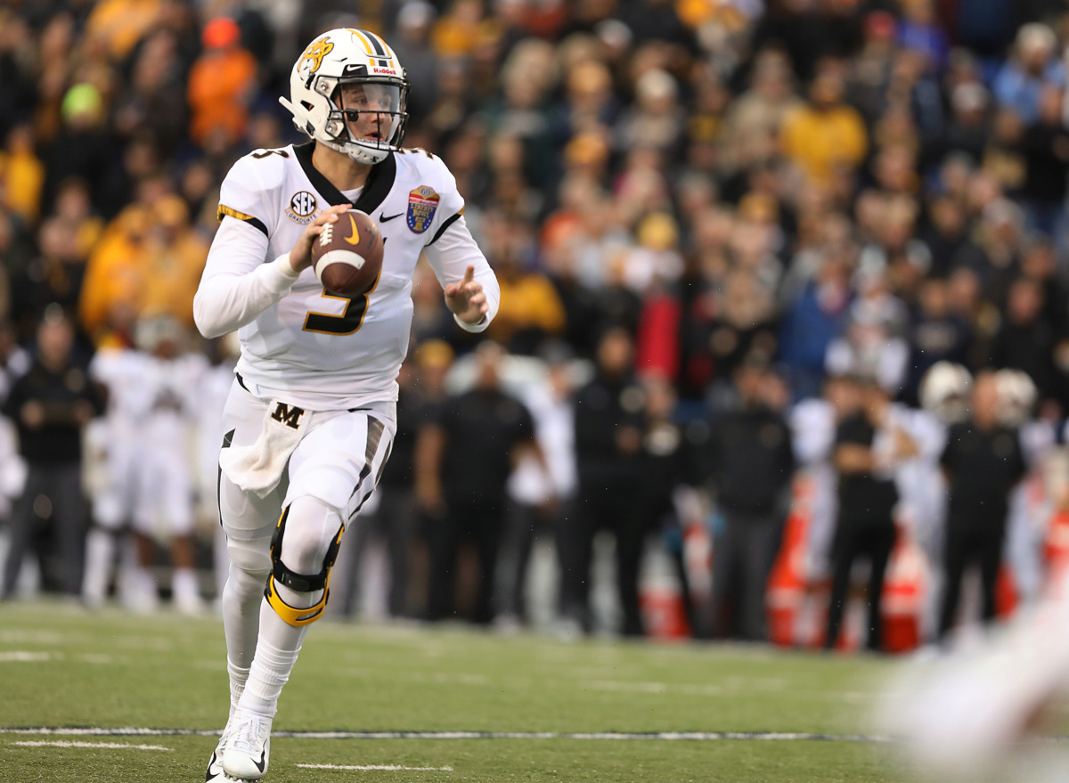 <strong>Missouri quarterback Drew Lock (3) directs traffic in the endzone as he scrambles from a defender in the first quarter of the AutoZone Liberty Bowl.</strong> (Patrick Lantrip/Daily Memphian)