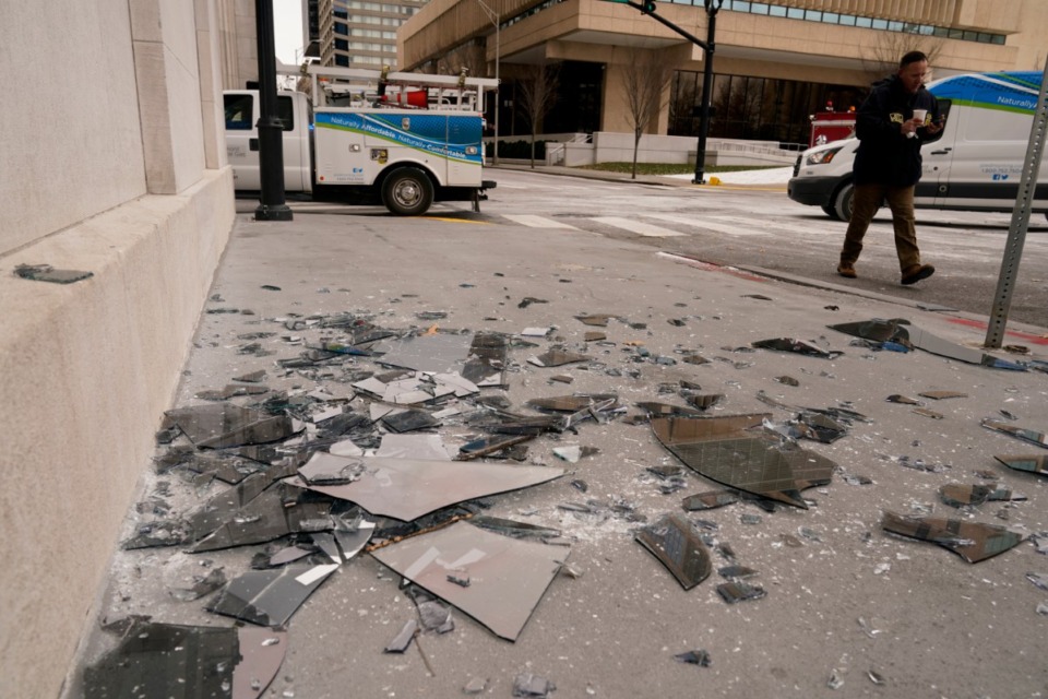 <strong>Broken window glass is scattered near the scene of an explosion in downtown Nashville, Friday, Dec. 25, 2020. Buildings shook in the immediate area and beyond after a loud boom was heard early Christmas morning.</strong> (Mark Humphrey/AP)