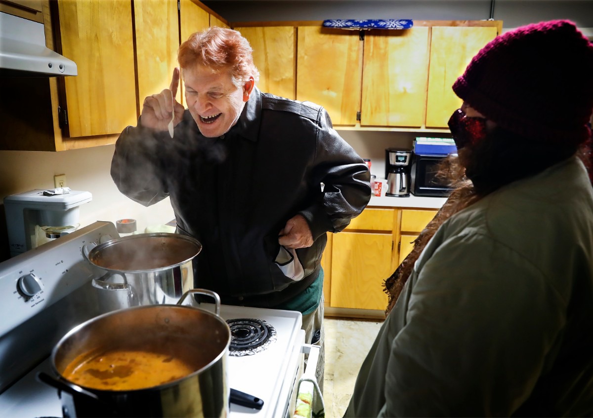 <strong>Lunches &rsquo;N Love outreach ministries&rsquo; volunteer Patrick Earl (left) cooks chili that will accompany warm clothes and supplies handed out to the needy on Friday, Dec. 25, 2020.</strong> (Mark Weber/The Daily Memphian)