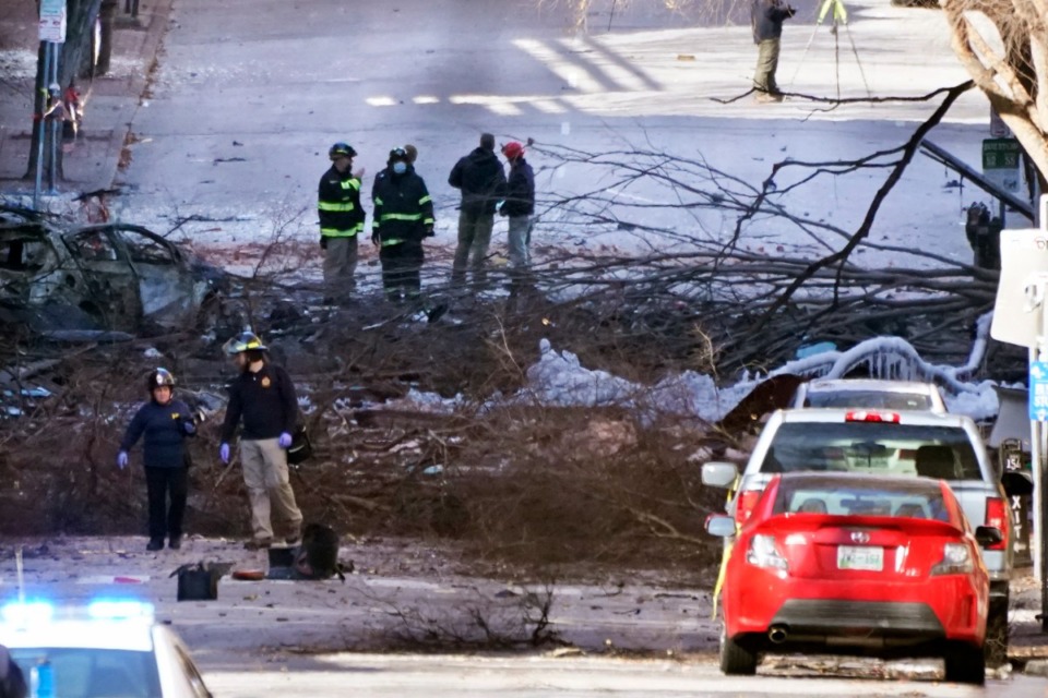 <strong>Investigators work Saturday, Dec. 26, 2020, at the scene of an explosion in Nashville. The blast that shook the largely deserted streets of downtown Nashville early Christmas morning shattered windows, damaged buildings and wounded three people. Authorities said a person of interest has been arrested.</strong> (Mark Humphrey/AP)