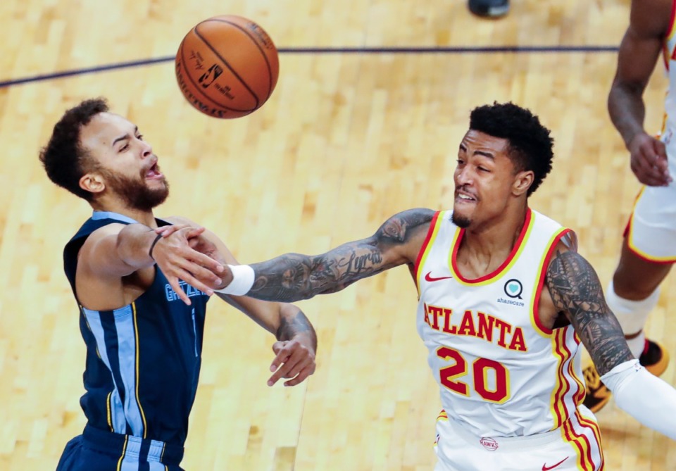 <strong>Memphis Grizzlies forward Kyle Anderson (left) is fouled by Atlanta Hawks defender John Collins (right) during action on Saturday, Dec. 26, 2020.</strong> (Mark Weber/The Daily Memphian)
