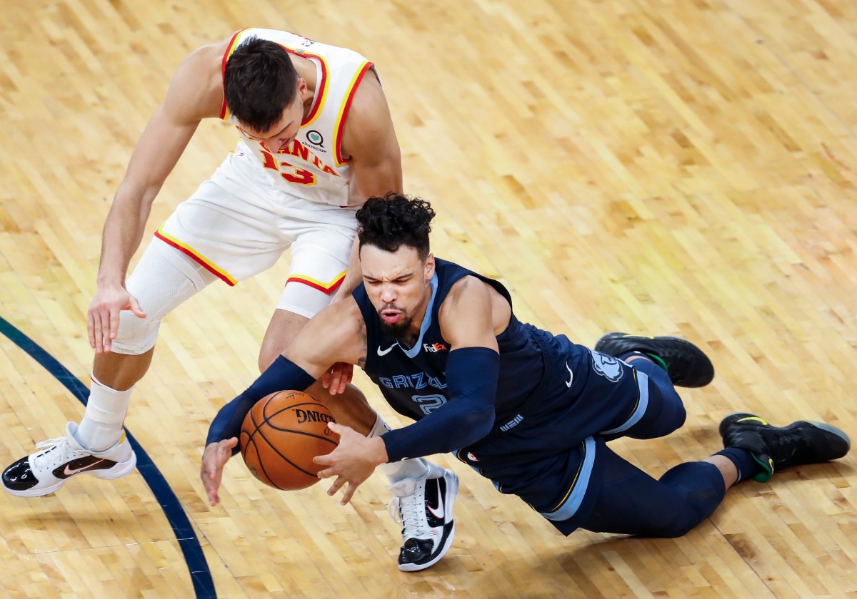 <strong>Memphis Grizzlies guard Dillon Brooks (right) battles for a loose ball with Atlanta Hawks guard Bogdan Bogdanovic (left) during action on Saturday, Dec. 26, 2020. (</strong>Mark Weber/The Daily Memphian)