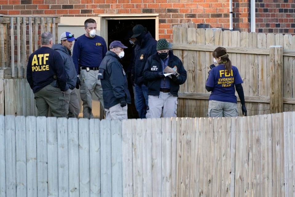 <strong>FBI and ATF agents search the basement of a home Saturday, Dec. 26, 2020, in Nashville.</strong> (Mark Humphrey/AP)